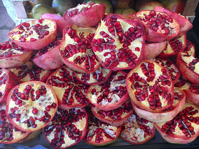 Piles of locally grown pomegranates